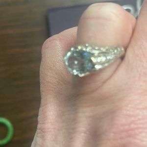 Designed and handmade aquamarine stone with diamonds on each side ring